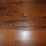 Close up of douglas fir rustic rough sawn reclaimed wood floor