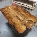 Shiny reclaimed wood table top by Manomin Resawn Timbers