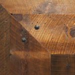 Close up of texture on weathered antique reclaimed wood flooring