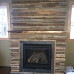 reclaimed paneling above fireplace