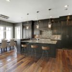 Kitchen with dark weathered antique wood flooring