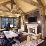 Living area with fireplace and hand hewn timbers