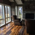 Living area with mixed reclaimed wood flooring