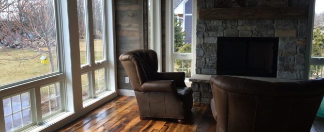 Living area with mixed reclaimed wood flooring