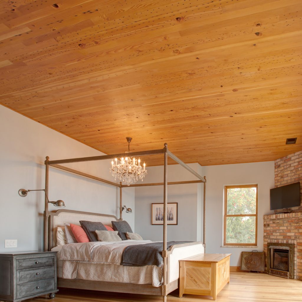 Southern Yellow Heart Pine Reclaimed Wood Wall Paneling in Bedroom