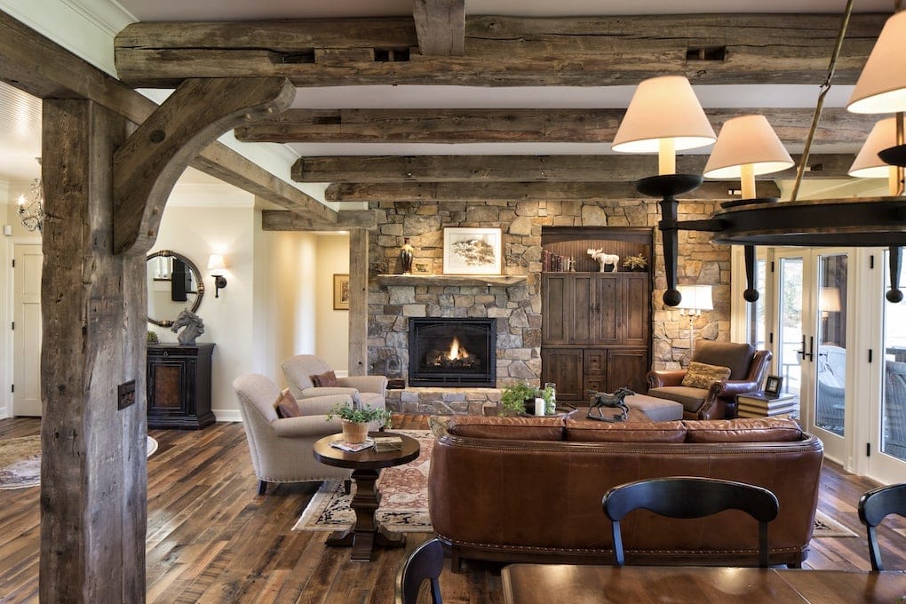 reclaimed barnwood flooring and beams inside of living room