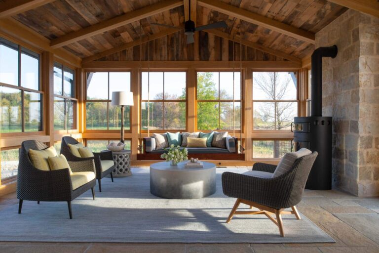 Interior space showcasing high-quality reclaimed wood walls paired with a vaulted wood ceiling and modern furnishings.