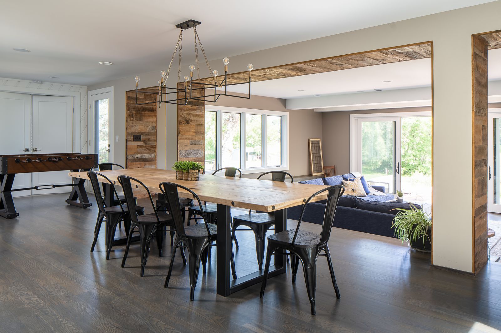 between the dining room and the living room reclaimed wood runs on. the inside of the walkway creating a cool accent