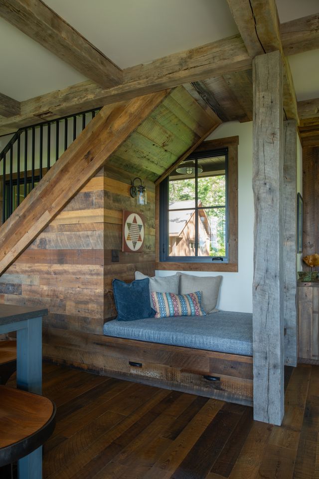 a reading nook area with barn wood accent around it