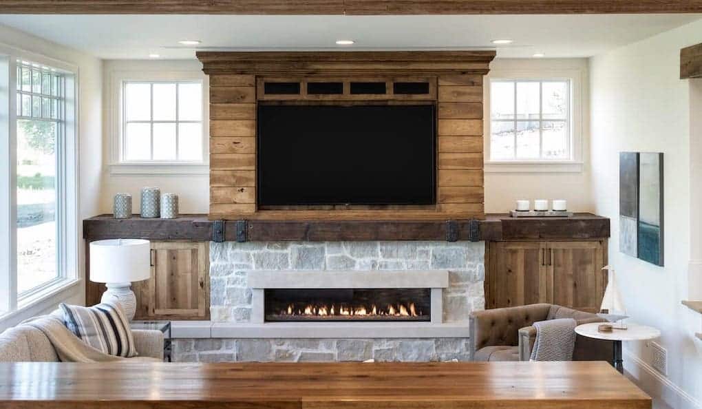 reclaimed wood mantel above warm fireplace; reclaimed wood ideas