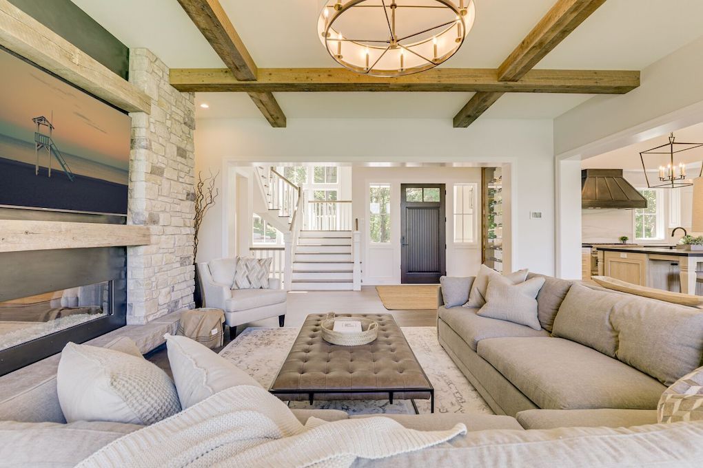 white living room with reclaimed wood beams