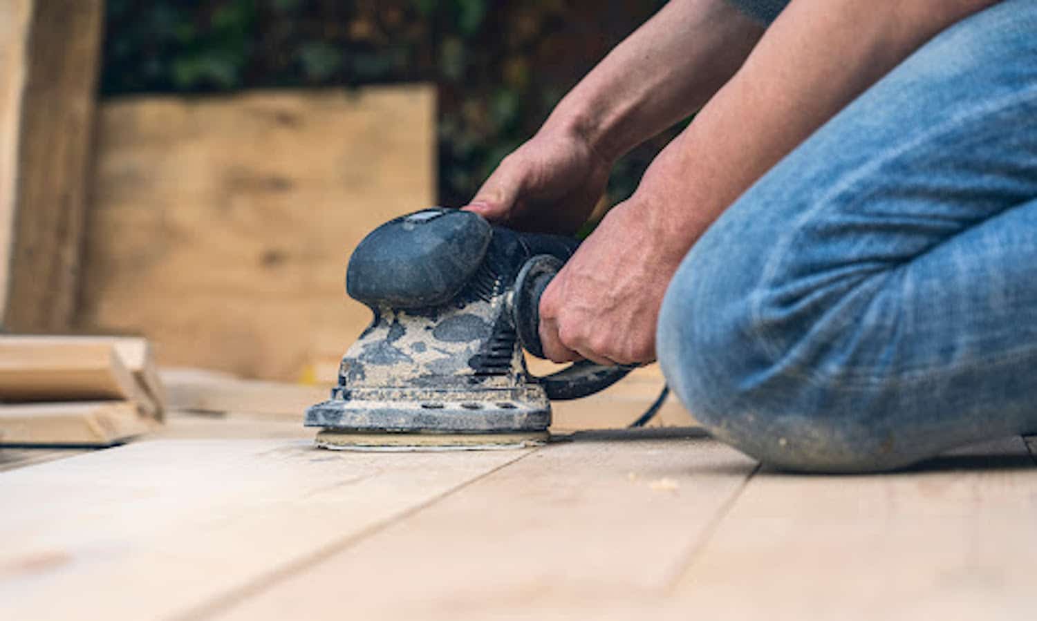 how to install reclaimed wood floor mans hands sanding new floors