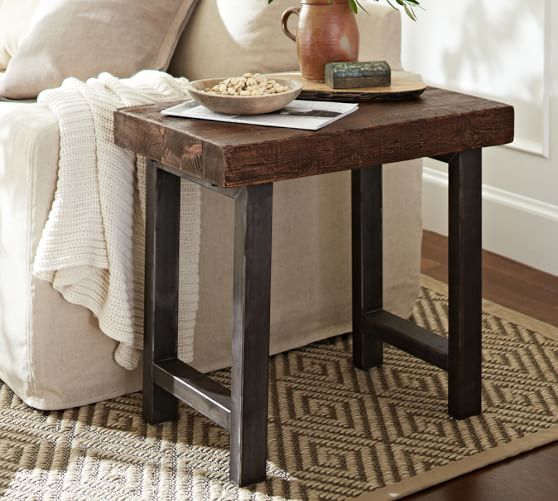 reclaimed wood end table on rug in living room