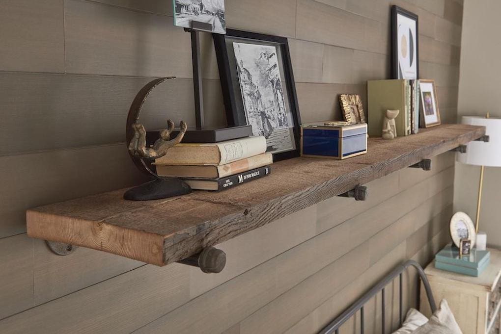 reclaimed wood shelve over bed next to reclaimed wood dresser