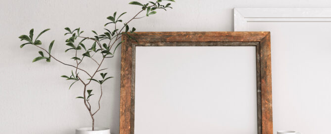 rustic picture frame on desk with plant