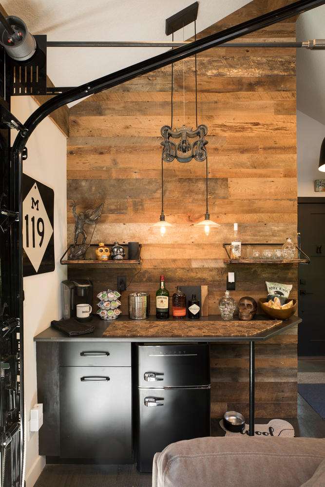 reclaimed wood wall paneling behind a dry bar from the Minnetonka man shed project by Great Northern Builders