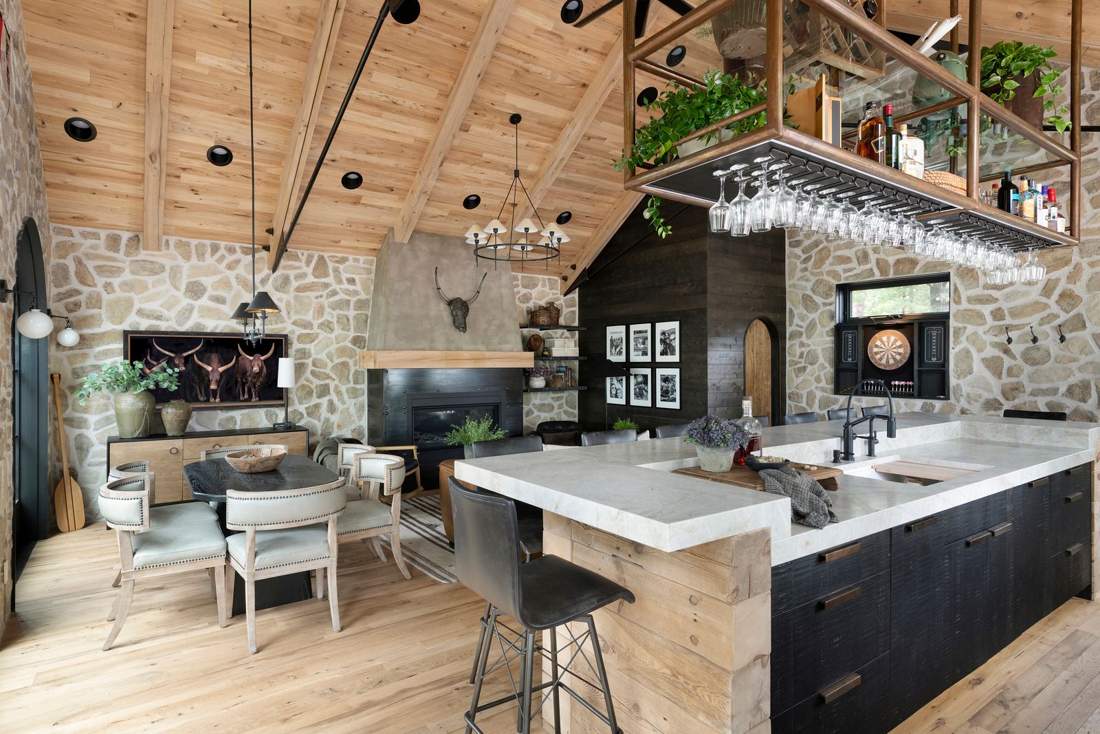 white oak reclaimed wood flooring in an open kitchen and dining room designed home