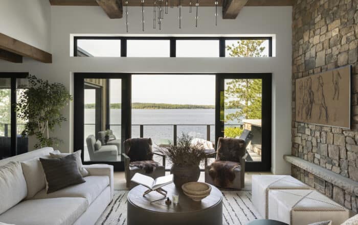 a view of the lake from the living room or great room that really boosts the amazing architecture design