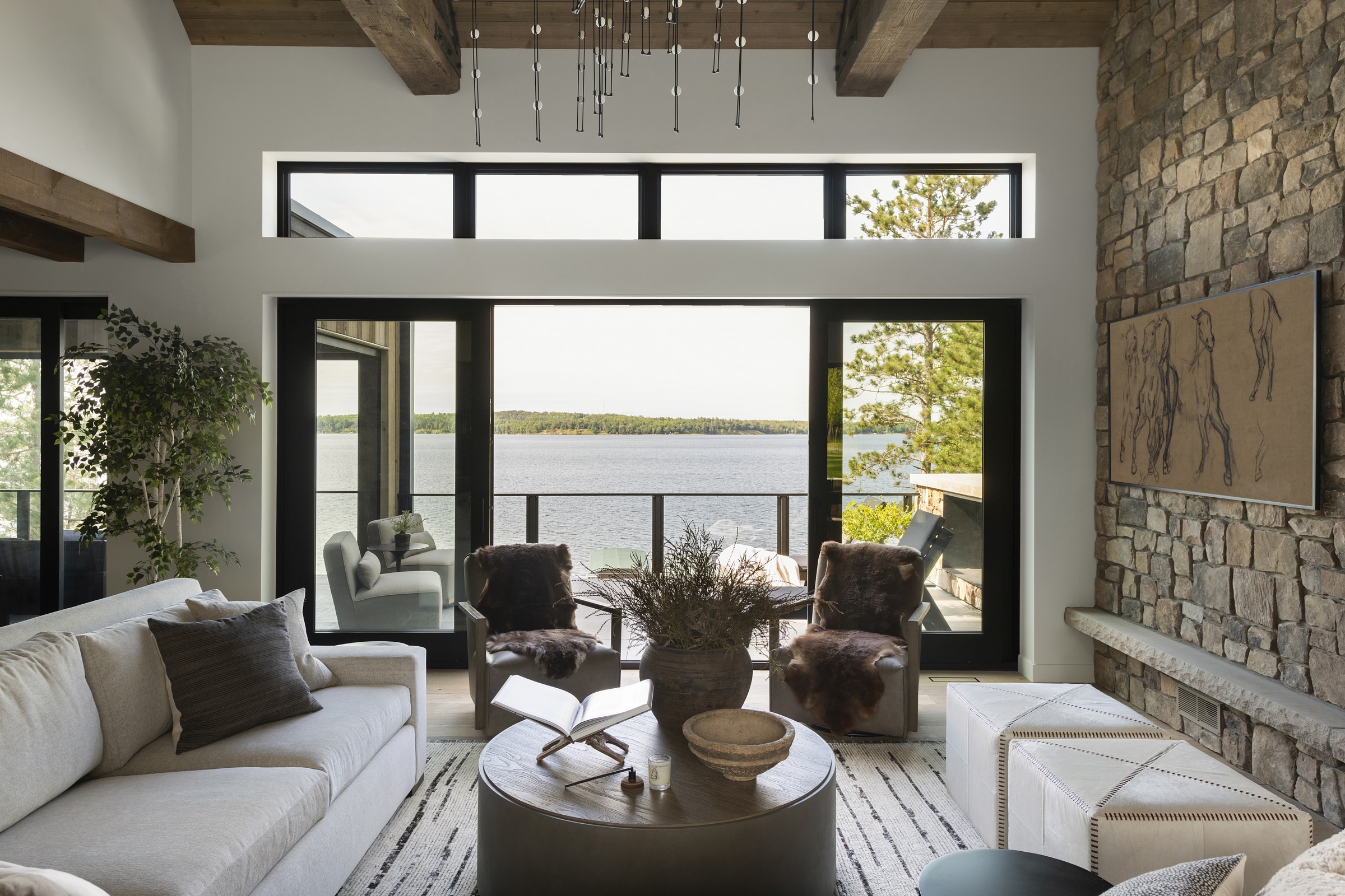 a view of the lake from the living room or great room that really boosts the amazing architecture design