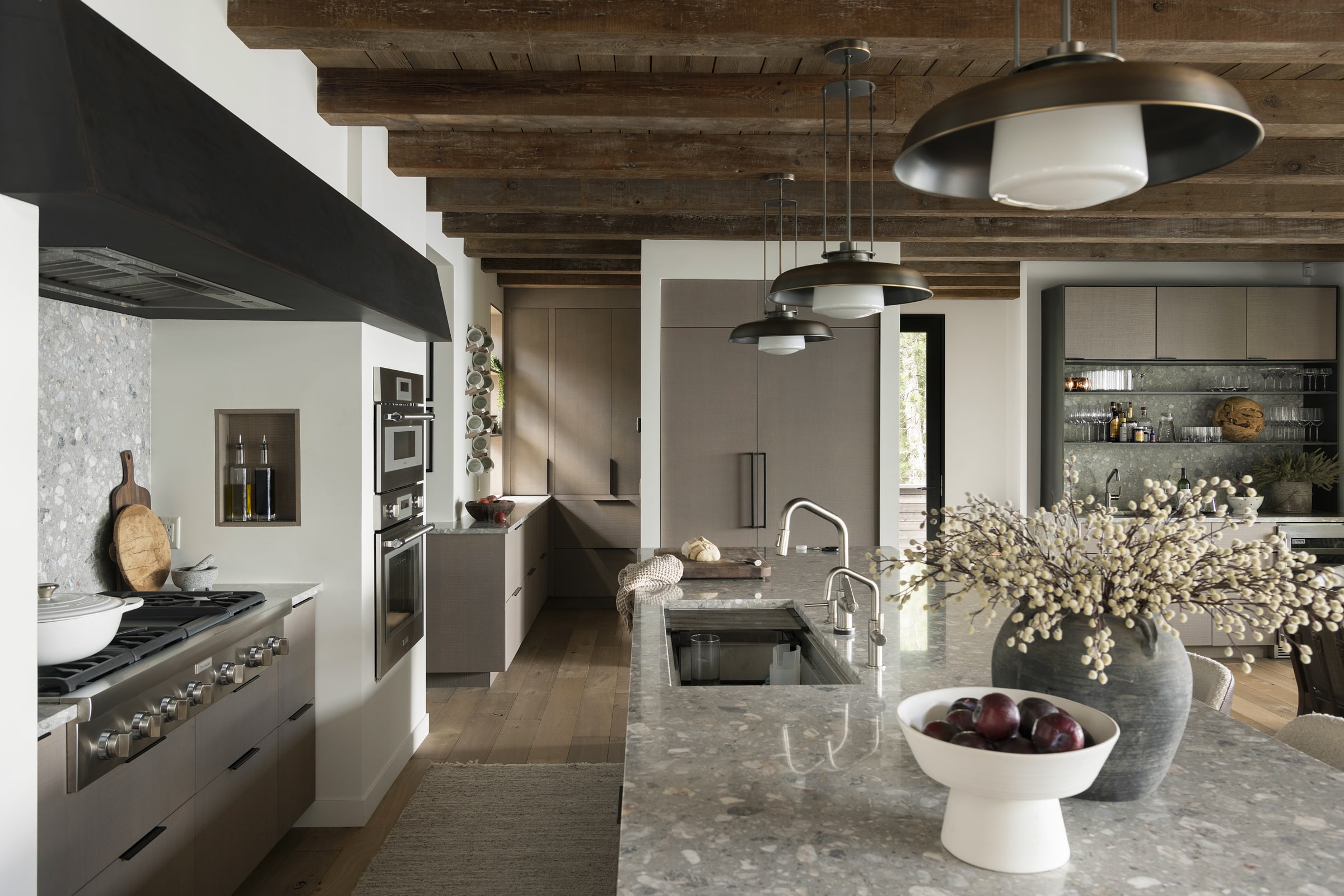 a look at the kitchen with weathered antique box beams spanning across the ceiling 