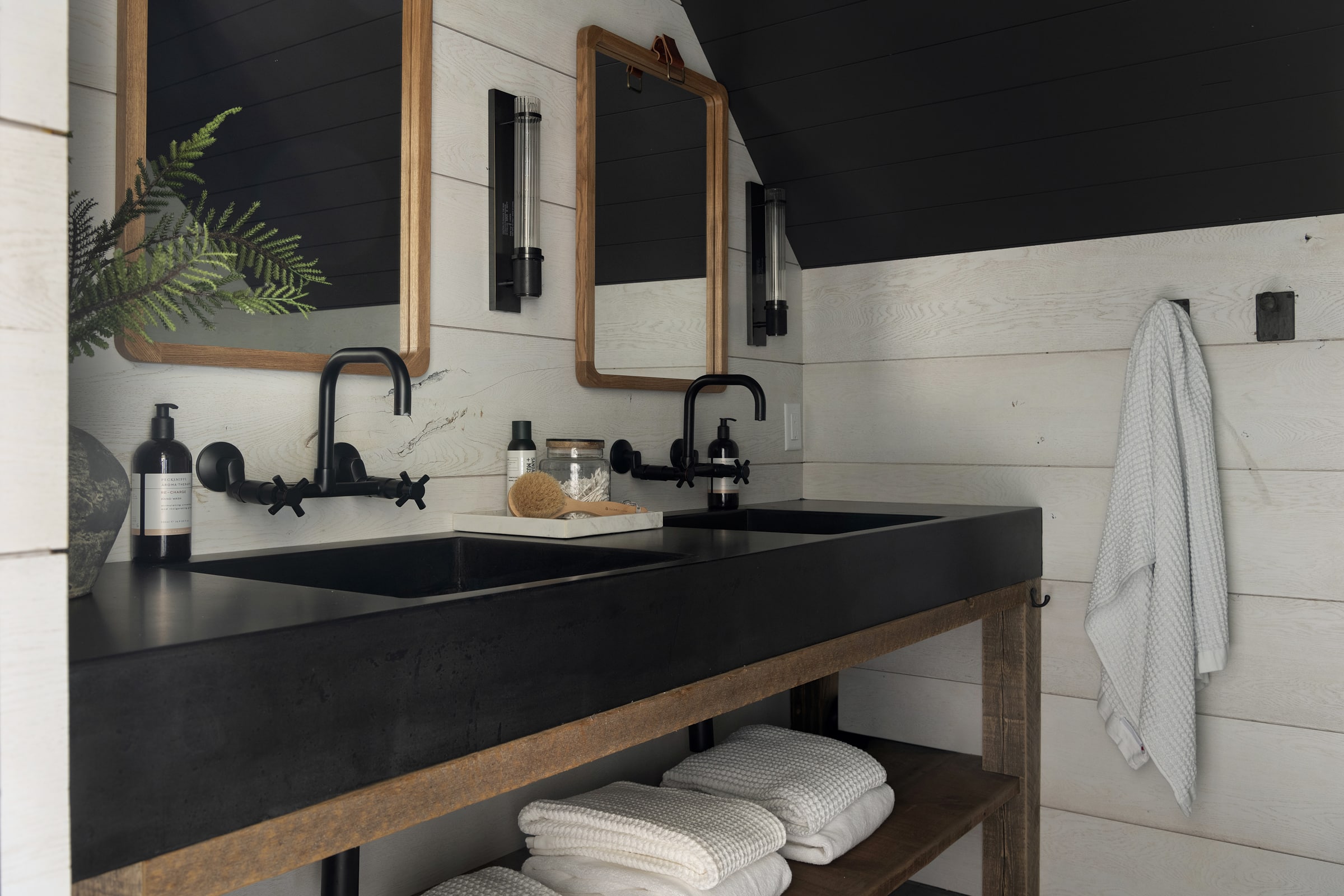 weathered antique reclaimed wood vanity legs emphasize this amazing bathroom