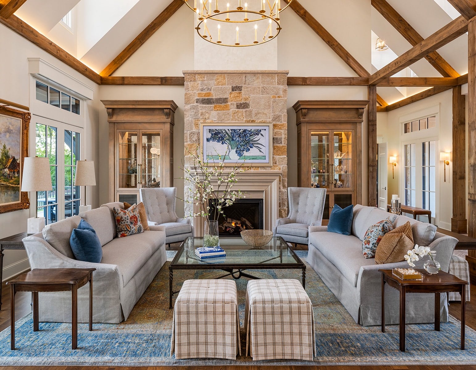 Lydiard Living Room Great room with reclaimed wood decorative beams lining the ceiling