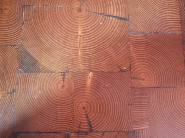 Antique end grain wood tile close up made from old growth reclaimed wood.