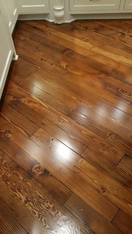 A close up shot of fir reclaimed wood flooring.