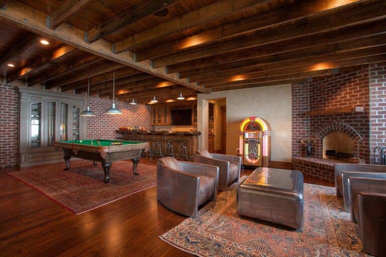 Antique Douglas Fir rough sawn reclaimed wood flooring in a living room area with a jukebox and box beams
