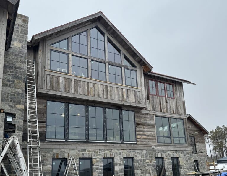 House exterior siding made from weathered gray reclaimed wood paneling.