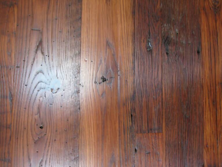 Close up of antique wormy chestnut  wood flooring.