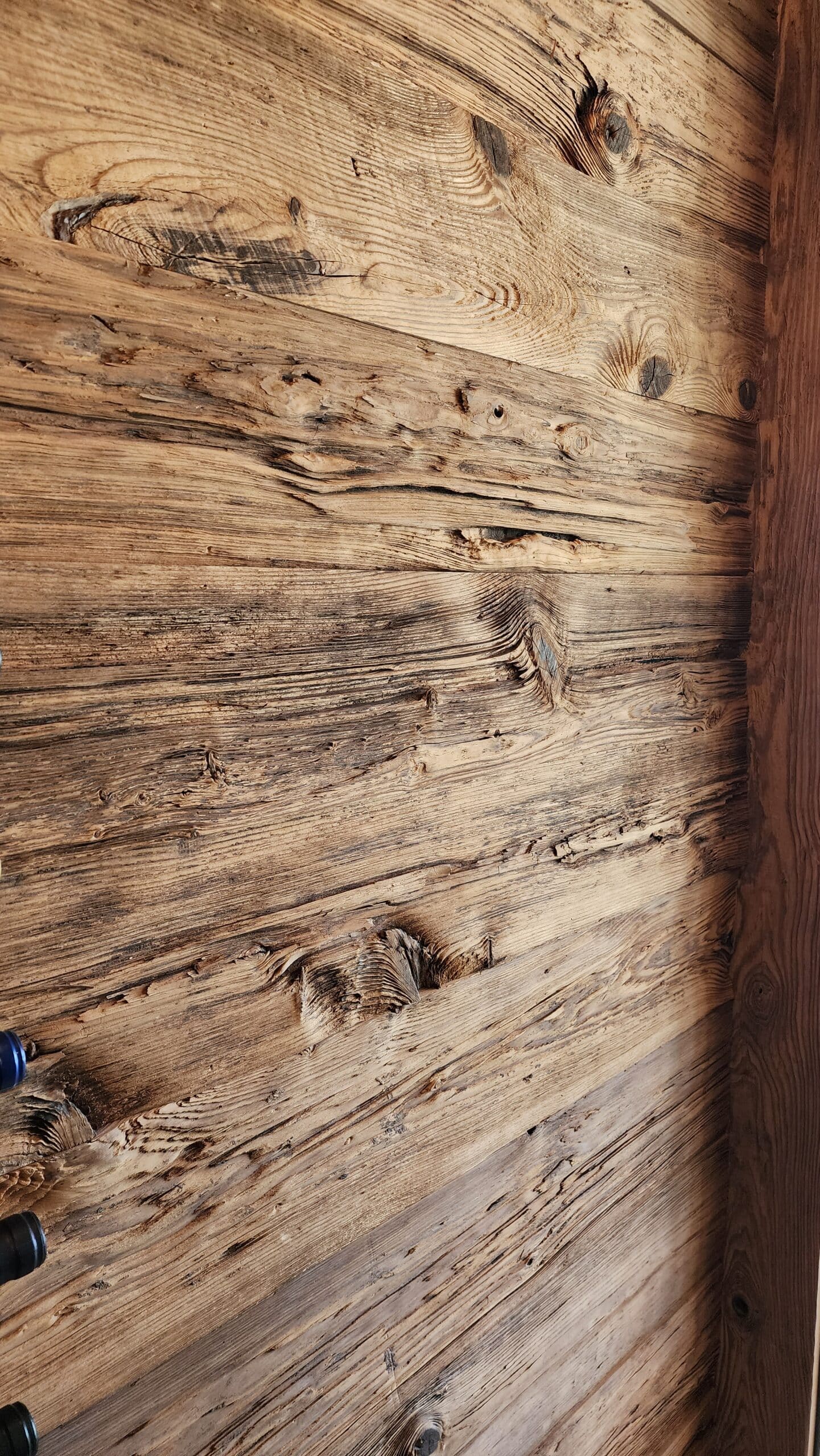 Close up of aged wood paneling with dark wood patina lines