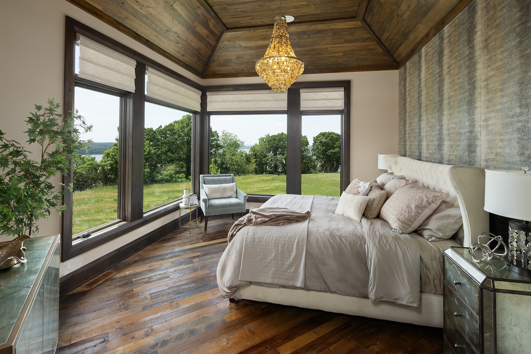 Bright bedroom with antique elm paneling on ceiling and weathered antique reclaimed wood floors