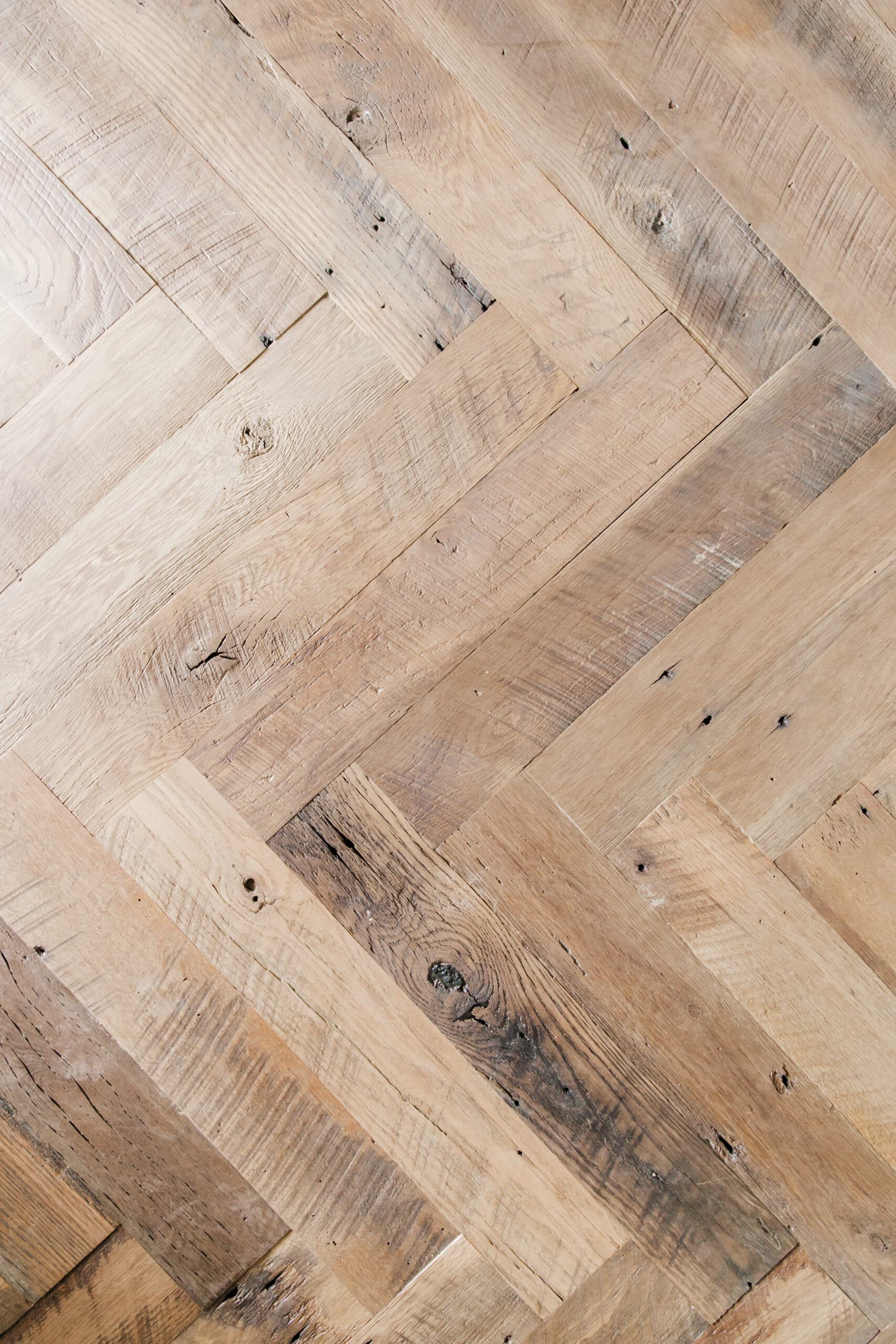 Antique wood patina on reclaimed wood herringbone paneling