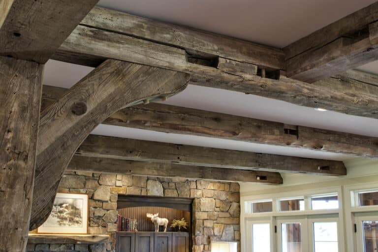 Aged wood hand hewn timber ceiling beams with wood patina