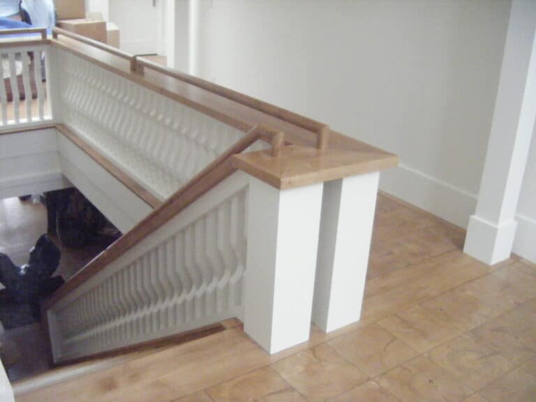 End grain wood tile floor on upper landing of staircase