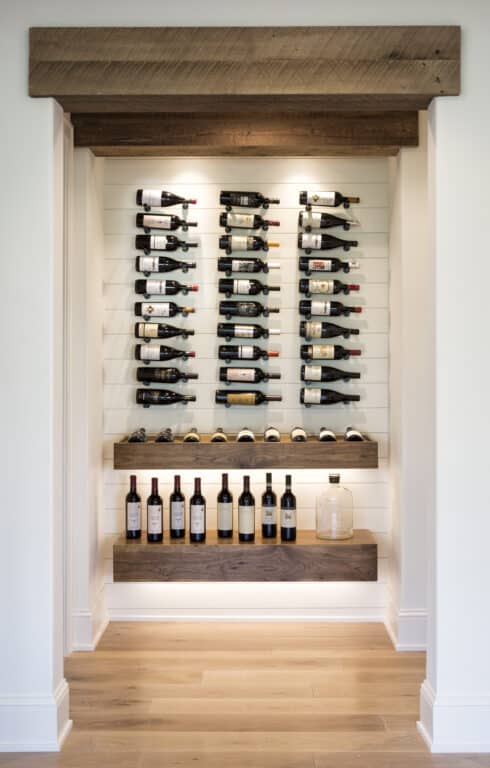 Custom home wine cellar ideas with antique box beam floating shelves