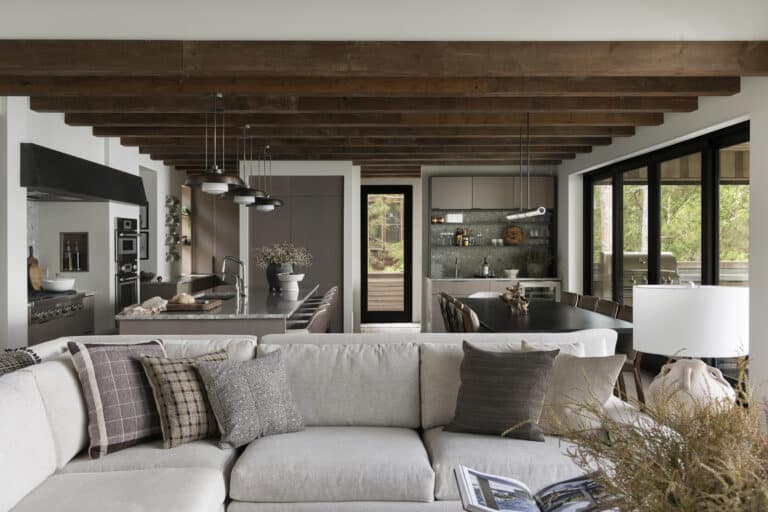 Luxury home living room with weathered antique box beams along ceiling