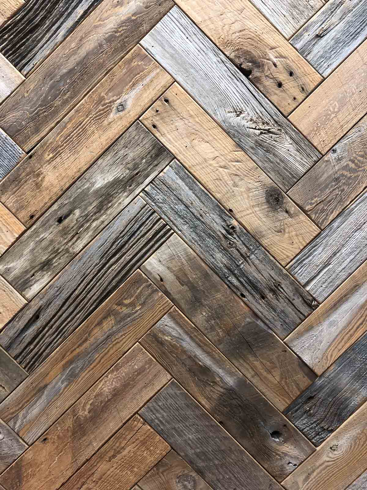Weathered-Gray-Reclaimed-Wood-Paneling-2 Close up of wood texture for weathered gray barnwood paneling in herringbone.