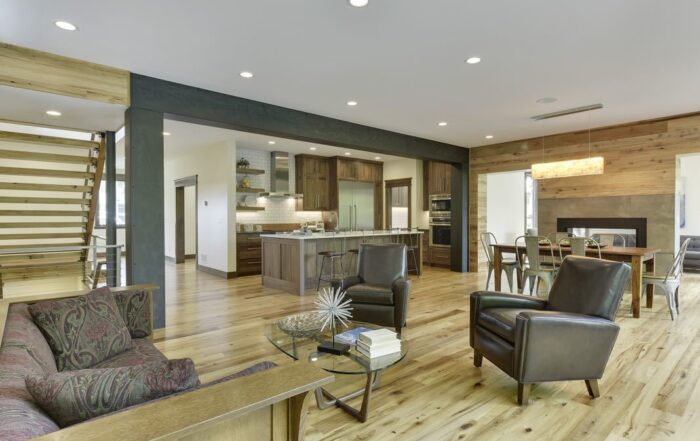 Antique reclaimed elm wood flooring in open floor plan kitchen living area