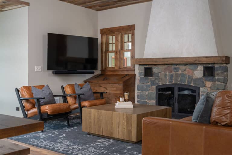 Cabin lounge with reclaimed wood fireplace mantel