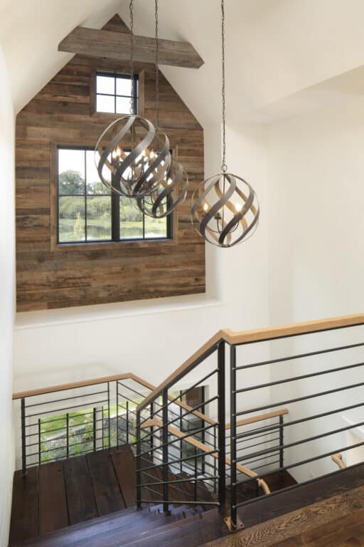 Reclaimed wood accent wall above stairwell
