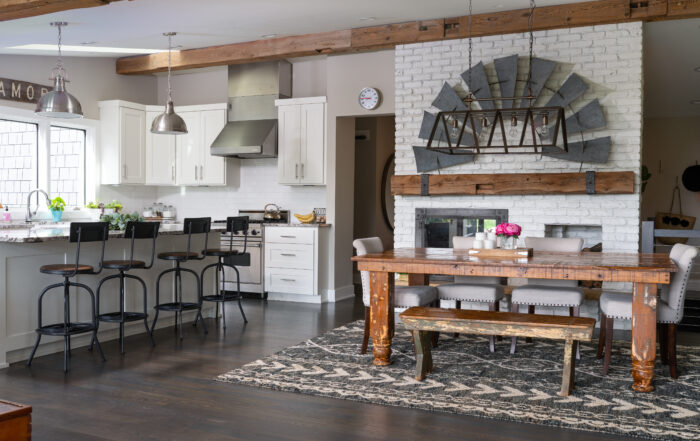 Modern farmhouse kitchen and dining area featuring salvaged wood beams, rustic dining table, and reclaimed wood accents—an inspiring example of creative wood projects in home design