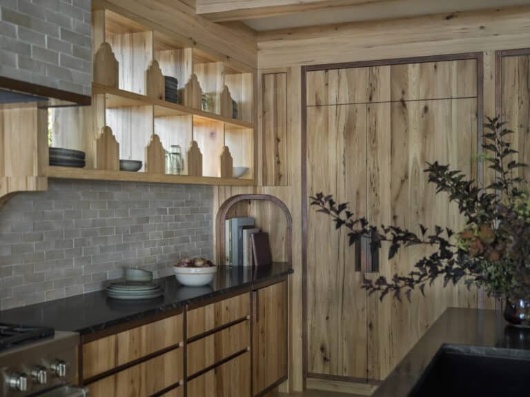 Antique elm wood paneling and shelving adding character to a sustainable home interior