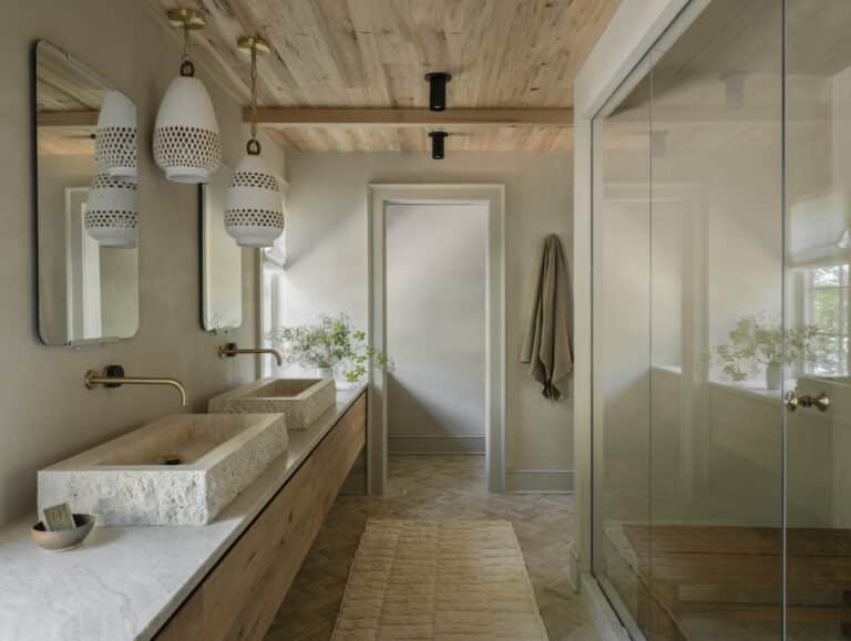 Bright bathroom with antique elm wood details and natural textures in a sustainable home