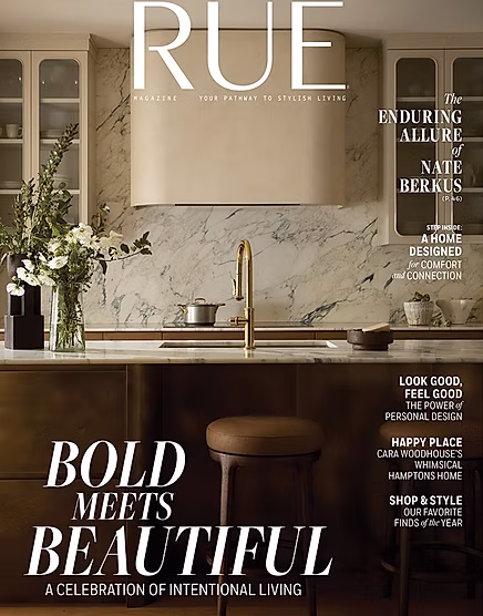 A magazine cover featuring a modern kitchen with marble walls, reclaimed wood cabinets inspired by Gull Lake, flowers in a vase, and stylish decor. Text highlights include Bold Meets Beautiful and articles on design, wellness, and style.